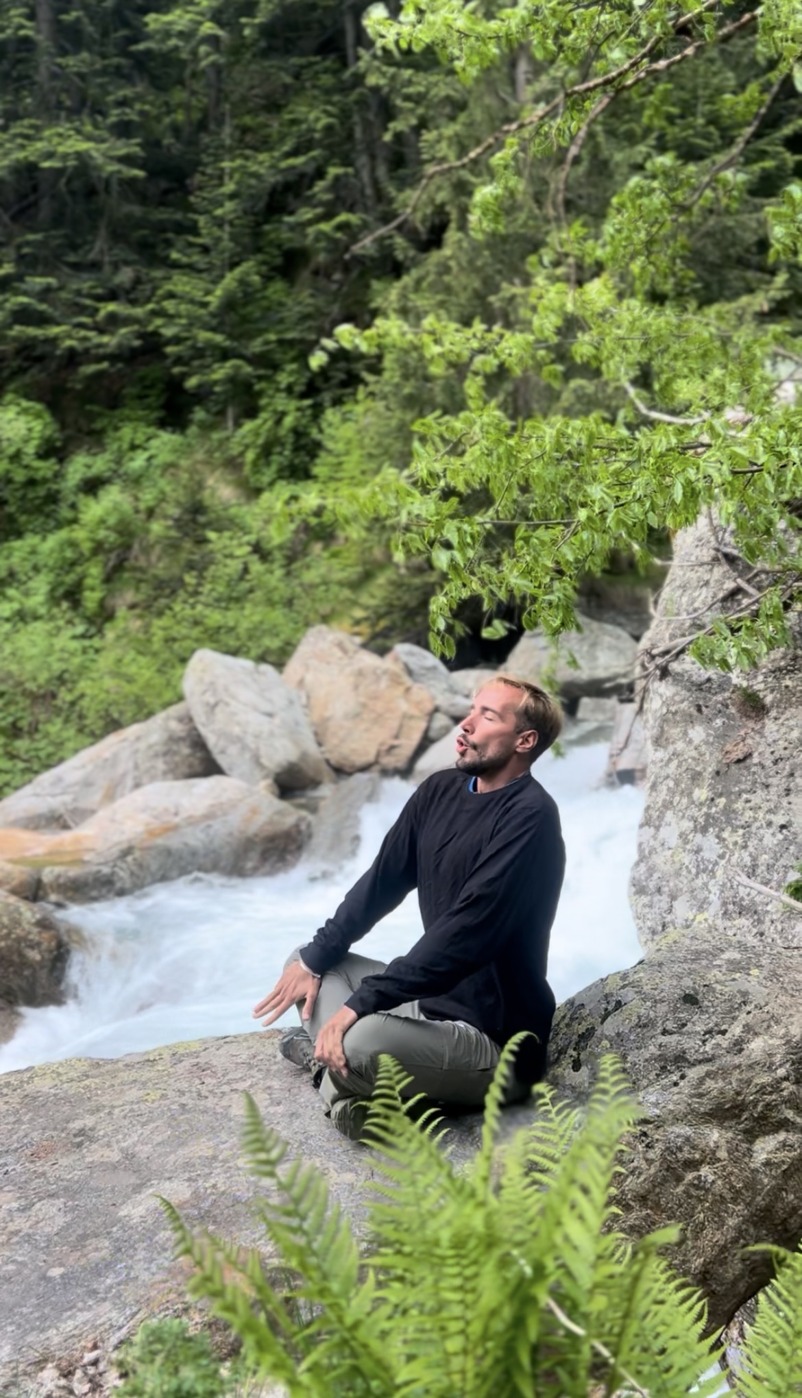 Mountain meditation retreat by waterfall